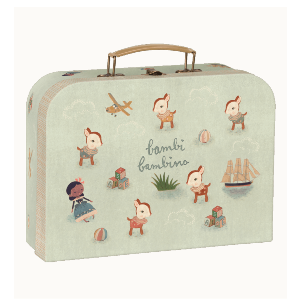 A light green, vintage-style Maileg suitcase decorated with illustrations of cute fawns, a girl with a crown, an airplane, a ship, a ball, clouds, and the text "bambi bambino." The suitcase has a tan handle on top and is perfect for stowing away small treasures or even your mouse with backpack from the Maileg Laundry Room Starter Set.