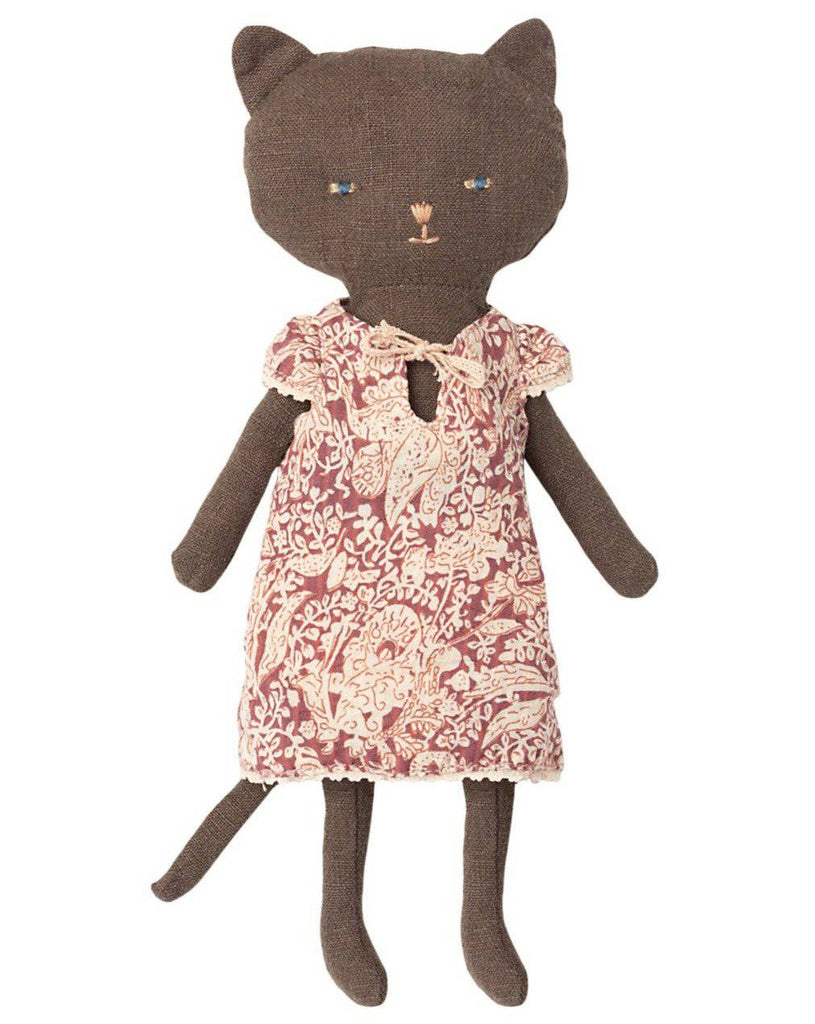A handmade Maileg Cat Stuffed Animal with a brown body and blue eyes, wearing a pink floral dress. The doll has a stitched face and long limbs.