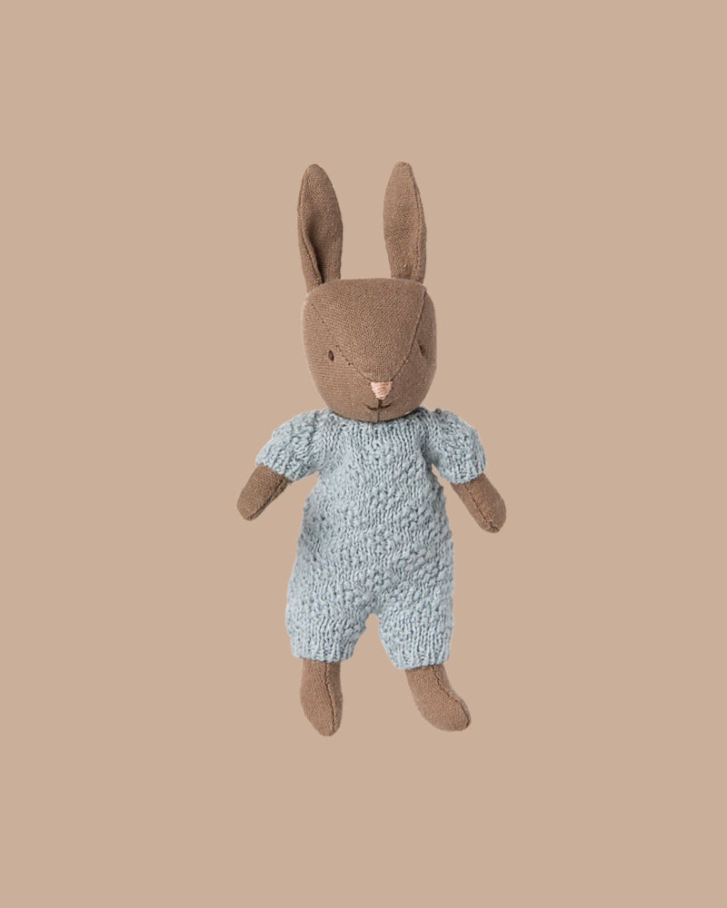 The PRE-ORDER Rabbit Micro - Brown wears a blue knitted suit, ideal for miniature dollhouses or pairing with Maileg accessories. Ships early October. Shown against a plain beige background.