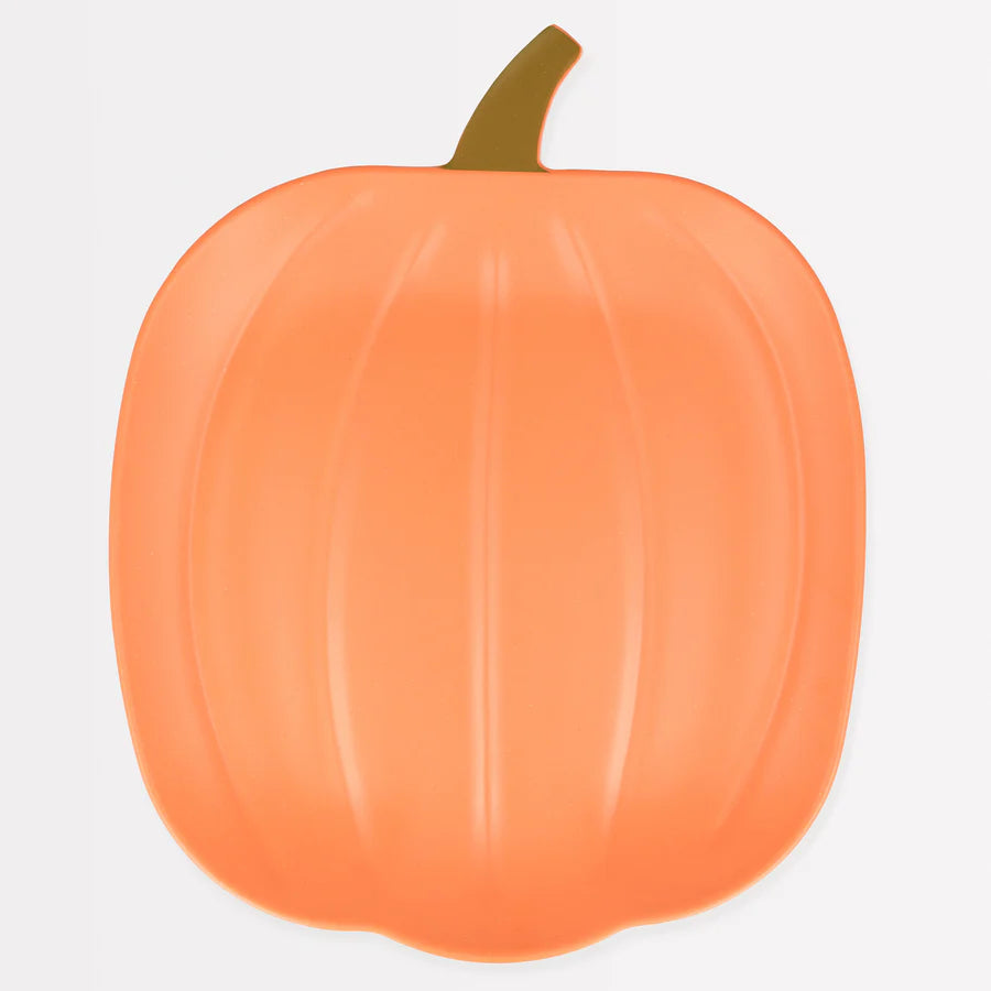 An illustration of an orange pumpkin with a brown stem, featuring smooth vertical grooves. The pumpkin is placed against a plain white background, closely resembling the Meri Meri Reusable Bamboo Pumpkin Plate design for Halloween.