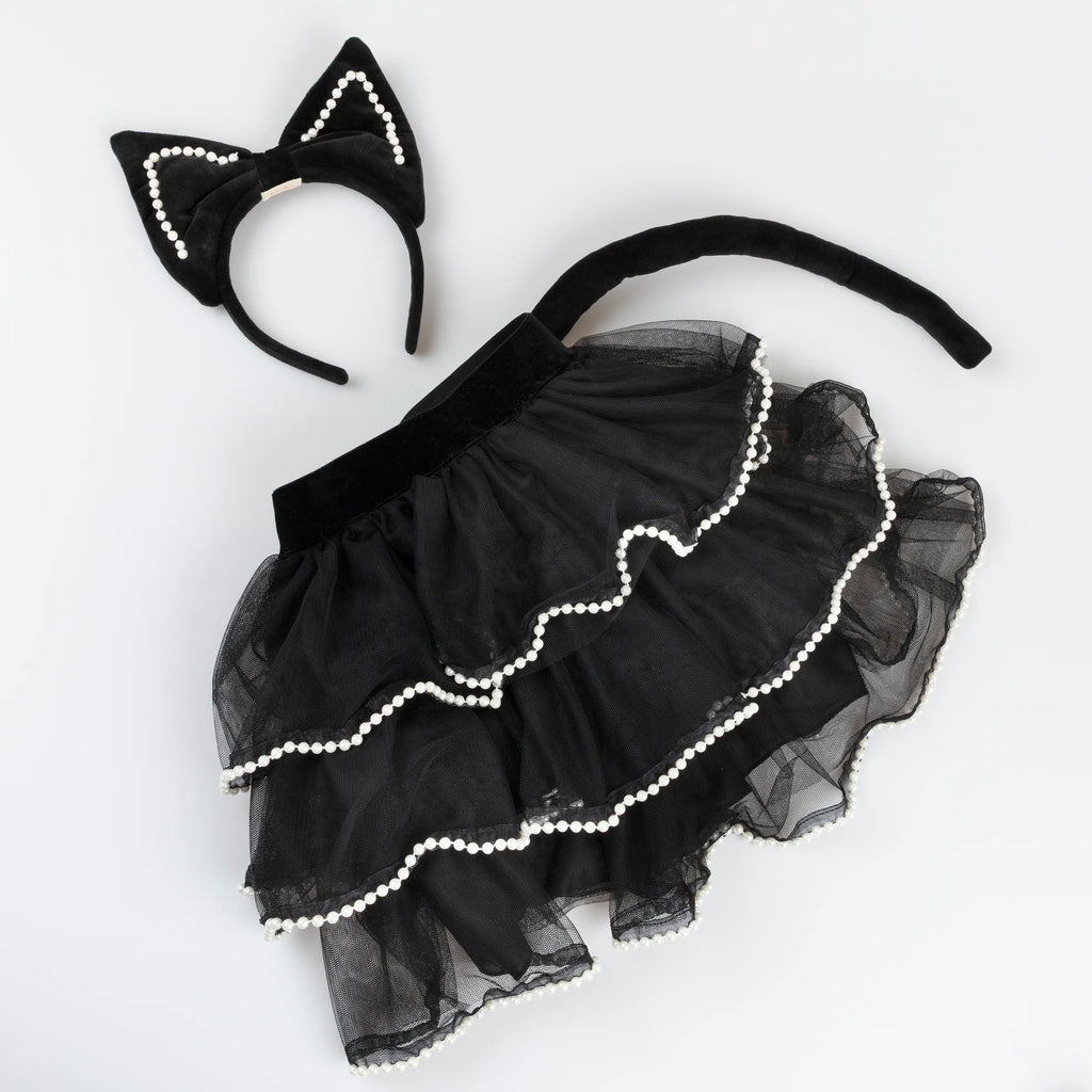 The Meri Meri Cat Costume - Final Sale includes a cat ears headband, black tulle skirt with white pearl trim, and a black tail, all stylishly displayed on a white background.