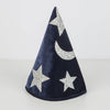 The Meri Meri Blue Velvet Wizard Costume - Final Sale features a cone-shaped velvet hat in dark blue, adorned with silver glitter stars and a crescent moon, standing upright on a plain light surface. Perfect for magical dress-up!.