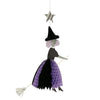 The Meri Meri Flying Honeycomb Witch Decorations - Final Sale features a Halloween decoration with a paper witch hanging from a string attached to a silver star. The flying witch is adorned with a black hat and a black and purple honeycomb paper dress, holding a broomstick as if mid-flight. Perfect for adding spooky charm to your Halloween party decor.