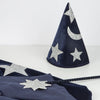 The Meri Meri Blue Velvet Wizard Costume—Final Sale—features a dark blue hat with silver glitter stars and a crescent moon, matching wand, and blue velvet cape, all displayed on a white surface for magical dress-up.