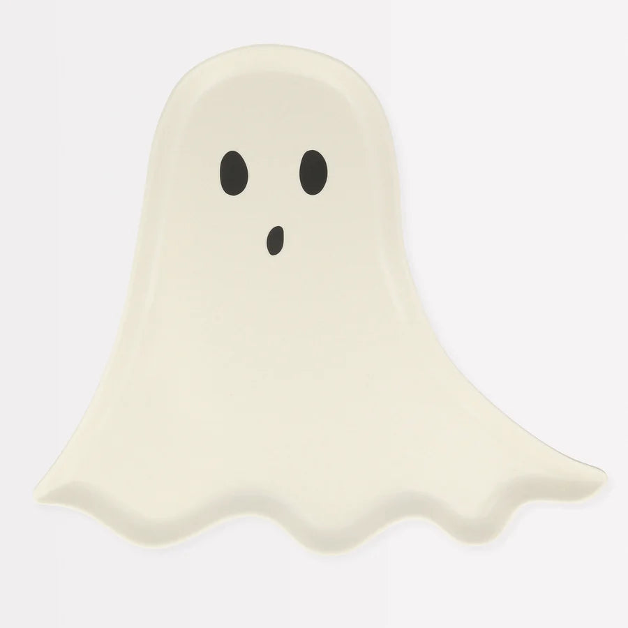 A simple, cartoon-style ghost illustration with a white, sheet-like body and a rounded top. It has two black oval eyes and a small, round, surprised-looking mouth. The ghost's lower edge is slightly wavy, creating a flowing effect. Perfect for Halloween parties on the Meri Meri Reusable Bamboo Ghost Plate. Background is white.