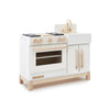 The Milton & Goose Essential Play Kitchen, made in the USA, features a white and natural wood finish with a stove, knobs, oven, sink with faucet, and cabinet doors—perfect for imaginative play.