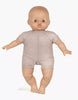 A photo of a Minikane Soft Body Doll (11") - Madder with a soft, phthalate-free vinyl body, dressed in a beige one-piece outfit. The doll has a smooth, light-colored complexion, bald head, and round open eyes. Positioned against a plain white background, this doll is perfect for imaginative playtime.