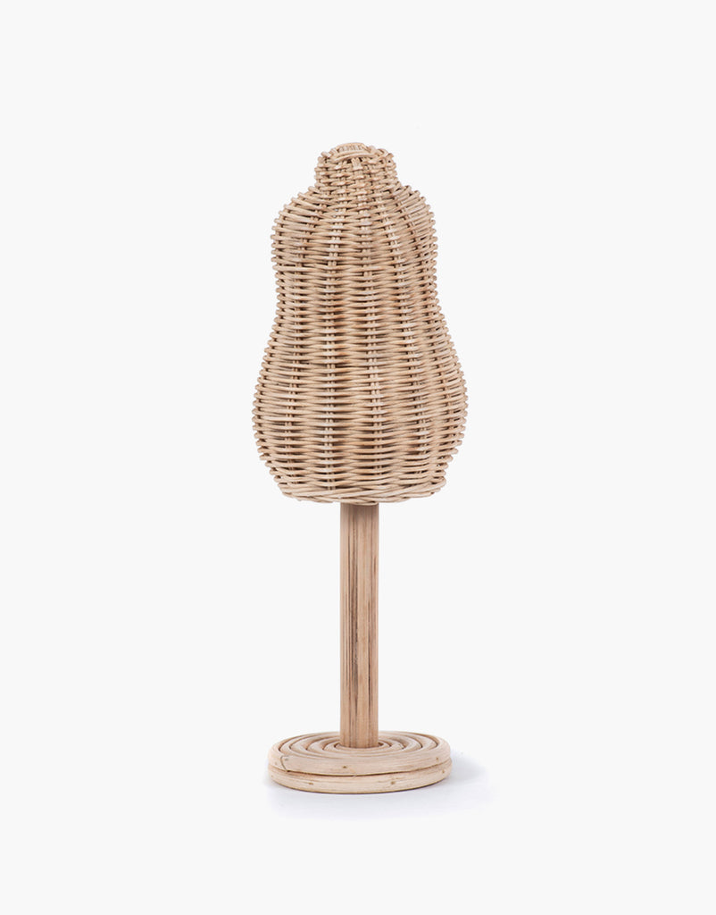 The Minikane Mannequin For Doll Clothing stands on a round wooden base, perfect for any dressing room. This torso-shaped miniature mannequin features an intricate woven pattern and is mounted on a smooth wooden pole. The plain white background emphasizes the natural materials and craftsmanship of the mannequin.