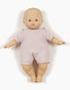 A Minikane | Petal Honeycomb Knit Shorty Bodysuit Doll Clothing with a neutral expression is dressed in a light pink, honeycomb mesh shorty bodysuit. The doll has blue eyes, a round face, and detailed hands and feet. It is photographed against a plain white background.