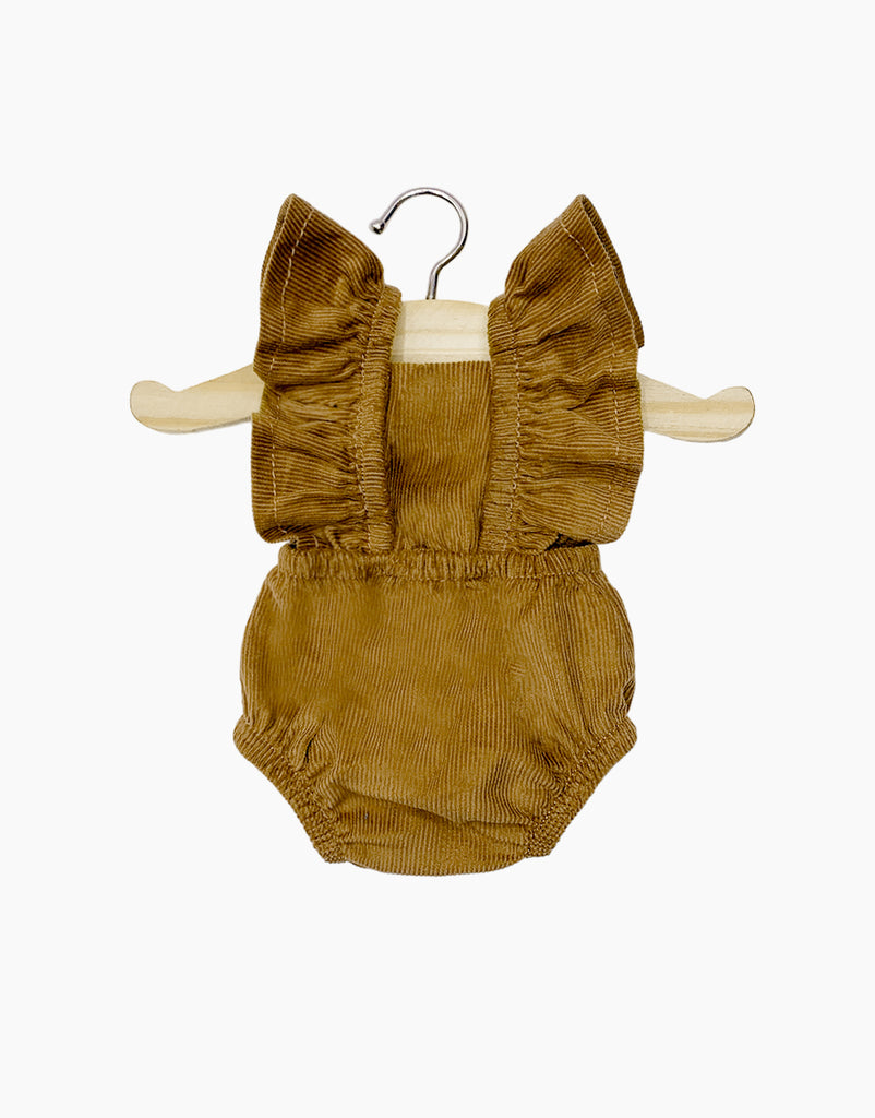 The Lou Retro Romper in brown corduroy, from the Minikane Doll Clothing collection, features charming ruffled straps and hangs elegantly on a wooden hanger against a plain white backdrop. It's the perfect size for accessorizing adorable Minikane dolls or other 13" and 14" dolls, with shipping estimated in approximately one week.