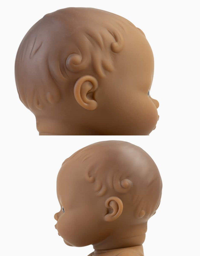 Two close-up side views of the Minikane Doll (13") - Leonie head, showing textured hair and facial features against a white background. The top photo is more zoomed in. Made from phthalate-free vinyl. Clothing sold separately.
