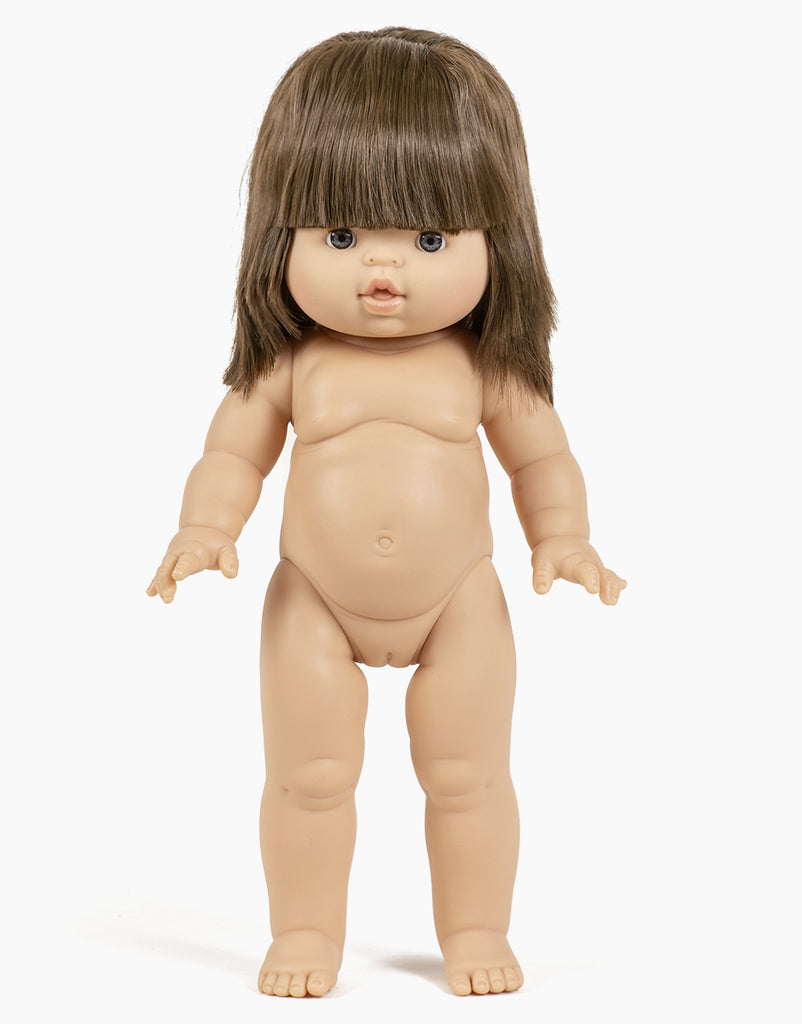 The Minikane Standing Doll (14") - Chléa stands upright against a white background, featuring straight brown hair with bangs, anatomically correct details, and neutral facial features. Clothing sold separately.