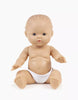 The Minikane Doll (13") - Rosalie, made in Spain from phthalate-free vinyl, features light skin, blue eyes, painted hair, and sits upright in a white diaper. Clothing is sold separately. Background is plain white.
