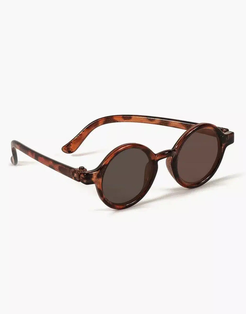 Minikane Doll Accessories | Harry Sunglasses: Round glasses with dark lenses and tortoiseshell brown frames, slightly bent arms, shown on a white background. Stylish accessory for Minikane dolls.