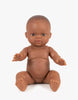 The Minikane Doll (13") - Zélie features brown skin and short hair, sitting upright with slightly spread arms and legs against a white background. This anatomically correct doll is beautifully made in Spain. Clothing sold separately.