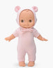 The Mini Pancha Doll - Ninon comes dressed in a pale pink mouse outfit with a hood featuring adorable mouse ears. This handcrafted vinyl doll stands upright with arms slightly outstretched, making it perfect for inspiring imaginative play.