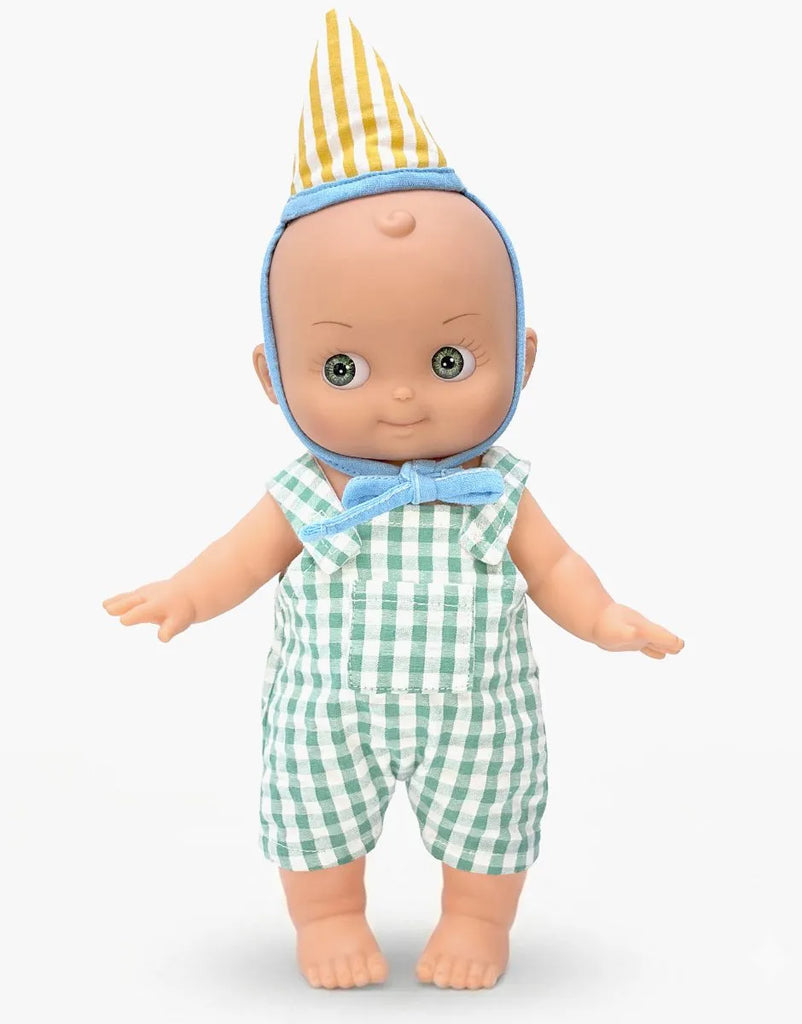 The Mini Pancha Doll - Zebulon with Green Gingham Birthday Outfit features a charming design with a yellow and white striped party hat, blue bowtie, and green-and-white checkered overalls. Crafted from high-quality vinyl, Zebulon stands barefoot against a plain white background—perfect for inspiring imaginative play.