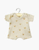 The Minikane 11" Doll Shorty Bodysuit in beige ribbed cotton with light brown hearts is perfect for Minikane Babies or baby dolls, shown here on a wooden hanger against a white background.