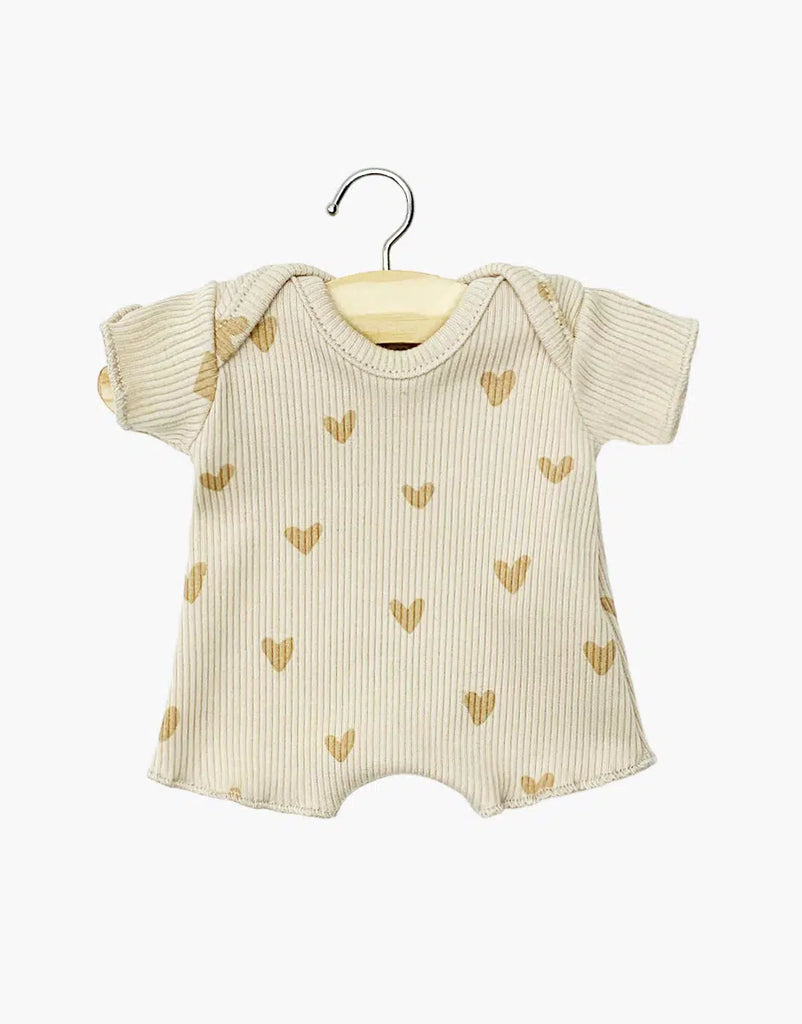 The Minikane 11" Doll Shorty Bodysuit in beige ribbed cotton with light brown hearts is perfect for Minikane Babies or baby dolls, shown here on a wooden hanger against a white background.