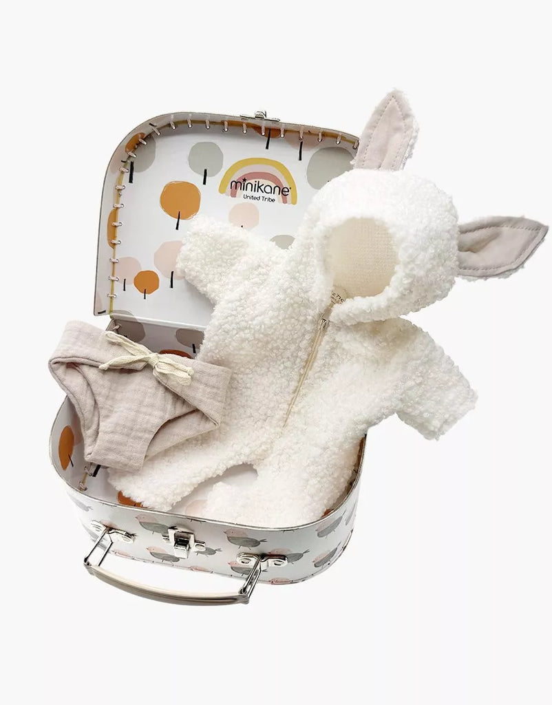 The Minikane 11" Doll Clothing | Jeannot Jumpsuit & Diaper in Suitcase Set features a fluffy white bunny-ear jumpsuit and beige diaper with bow, all presented in a suitcase. Perfect for Minikane Babies and displayed against a white background.