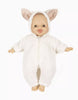 A Minikane 11" Doll wears the Jeannot Jumpsuit & Diaper in Suitcase Set—a fluffy white jumpsuit with a hood and light brown animal ears—shown on a white background.