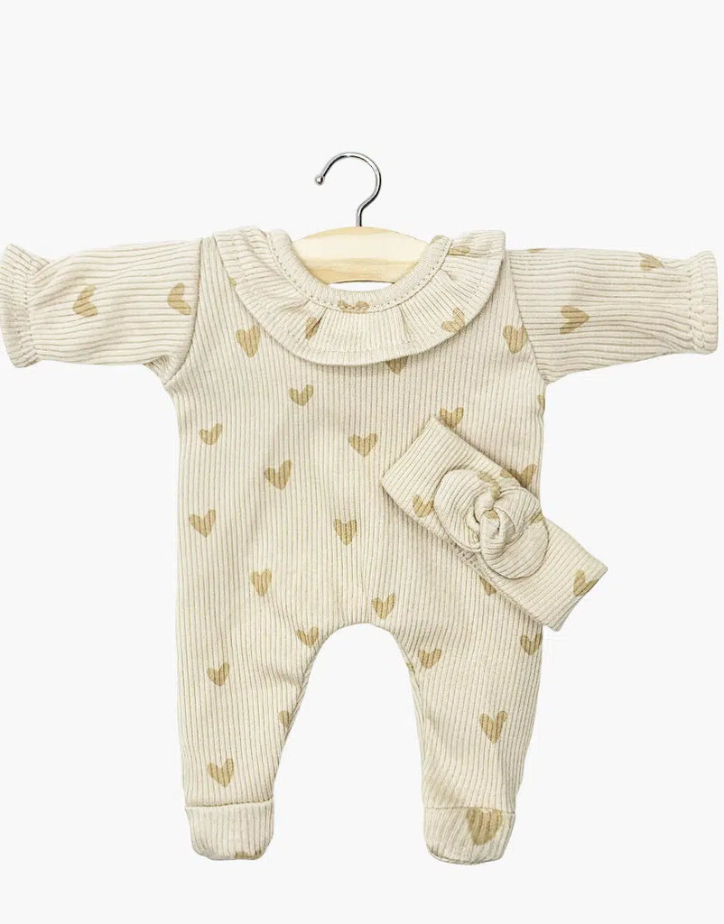 The Minikane 11" Doll Clothing set features the Camille Onesie & Headband in ribbed beige cotton with light brown heart patterns. The long-sleeved romper with matching knotted headband and collar is perfect for 11" baby dolls.
