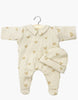 Minikane 11" Doll Clothing set includes the Sleep Well Corentin Onesie & Hat in beige hearts—featuring a cream color, long sleeves, footies, and collar. Includes a matching ribbed hat. Perfect for doll play or as a collectible accessory.