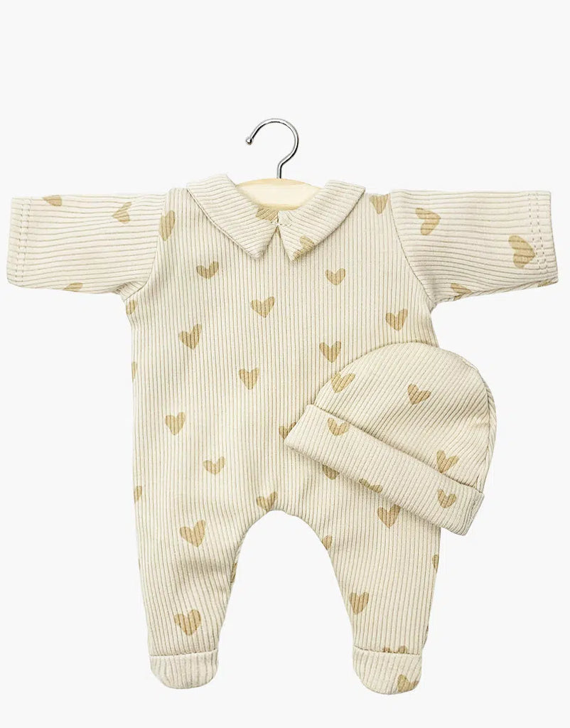 Minikane 11" Doll Clothing set includes the Sleep Well Corentin Onesie & Hat in beige hearts—featuring a cream color, long sleeves, footies, and collar. Includes a matching ribbed hat. Perfect for doll play or as a collectible accessory.