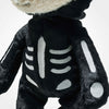 A close-up of the Steiff Mr. Bones Teddy Bear in a skeleton costume plush with white bone details on its chest and arms, and the head partially visible at the top.