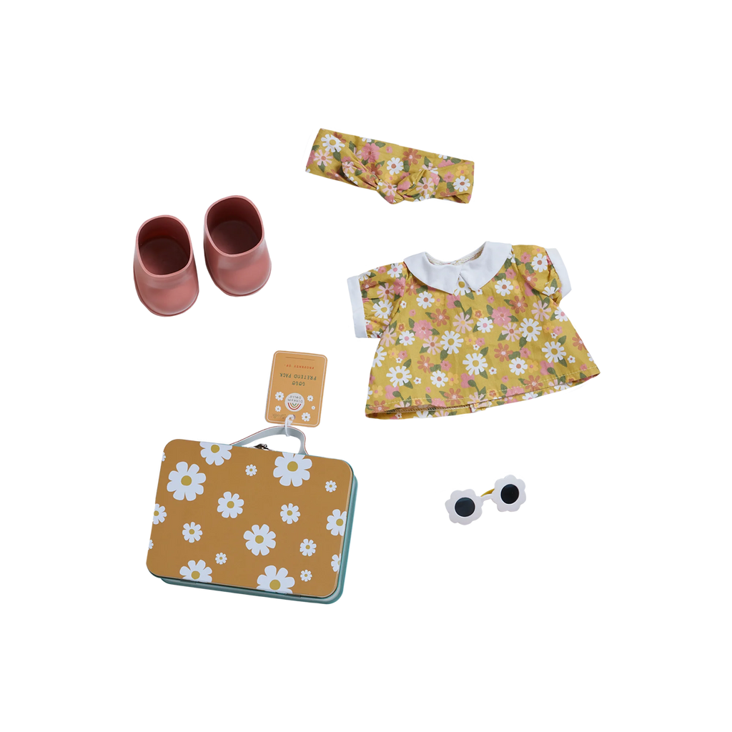 A neatly arranged collection of baby items which includes a floral dress, a headband, pink shoes, a walkie-talkie, a toy car, and a Dinkum Doll - Poppet (Extended Pack) bag, all placed on