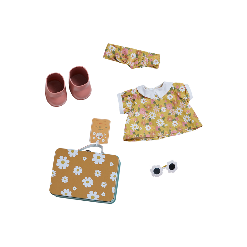 A set of doll accessories perfect for Dinkum Doll - Sprout (Extended Pack): a yellow floral dress with a white collar and embroidered details, pink shoes, a matching floral headband, white round sunglasses, and a yellow suitcase with white flower patterns. A tag is attached to the suitcase. Ideal for any Pretend Pack adventure.