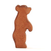 A Ostheimer Small Bear figurine standing on its hind legs, isolated on a white background. This handcrafted wooden toy has a smooth, natural wood finish and a simple, stylized design.