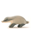 A simple Ostheimer Badger - Head Straight figurine, handcrafted with minimalistic features and painted in shades of gray and black, against a plain white background.
