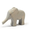 A Ostheimer Small Elephant - Trunk Out with a smooth finish and visible wood grains, standing isolated on a plain white background.
