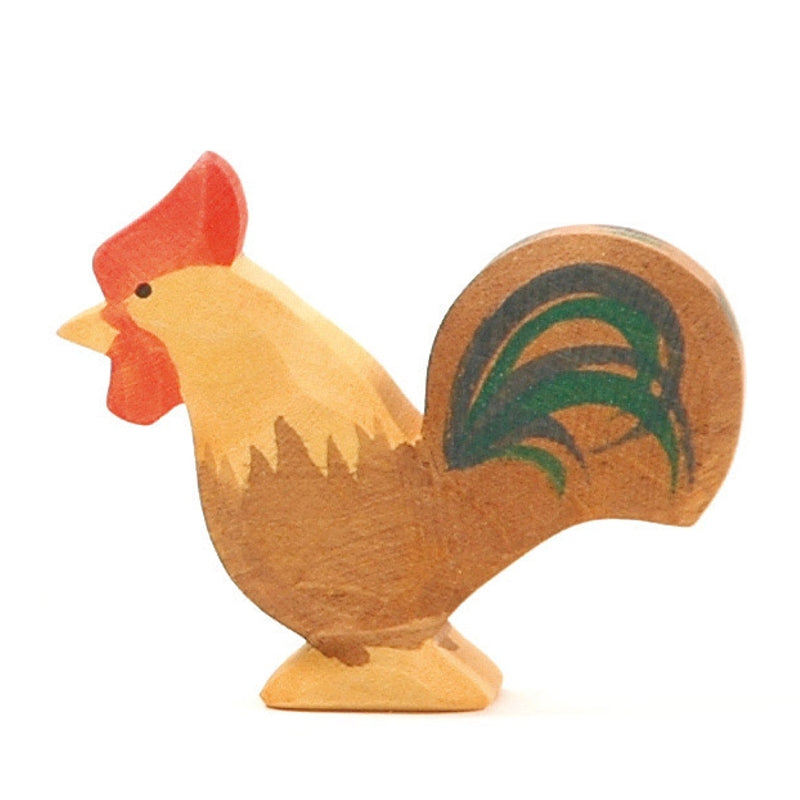 Ostheimer Rooster - Brown figurine, handcrafted with a natural finish, featuring painted details in red on the comb and green on the tail feathers, standing upright on a flat base.