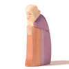 A Ostheimer Joseph painted with bright, pastel colors, depicting a blonde character with a simple, stylized facial feature, standing against a plain white background. This piece is ideal for imaginative play.