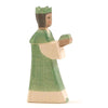 A Ostheimer Green King With Crown figurine, holding a scroll, with a simplistic and stylized design reminiscent of Ostheimer toys.