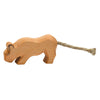 Handcrafted wooden toy shaped like an Ostheimer Lion with a simple, smooth design and a twine tail, isolated on a white background.