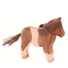 Ostheimer Pony, handcrafted with a two-tone body and a dark mane, standing against a plain white background.