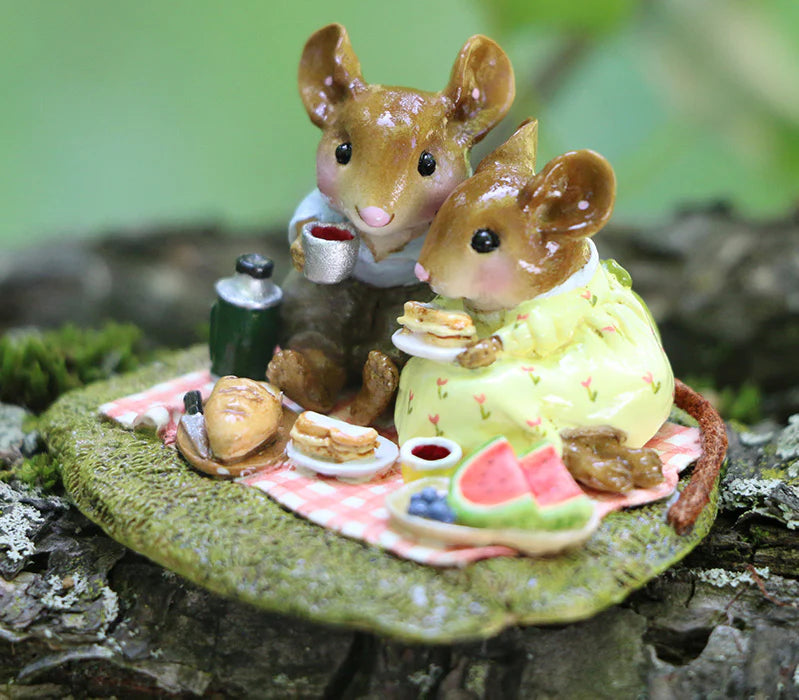 Two detailed Wee Forest Folk Tiny Collectible mice share a picnic on a blanket with teacups, sandwiches, pie, and watermelon amidst lush greenery—hand sculpted in "Just the Two of Us" (Not a Toy).