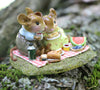 The Wee Forest Folk Tiny Collectible - Just the Two of Us features two hand-sculpted mice sharing a picnic with watermelon and pastries, sitting on a blanket amid moss and nature. Perfect for collectors, this piece is not a toy.