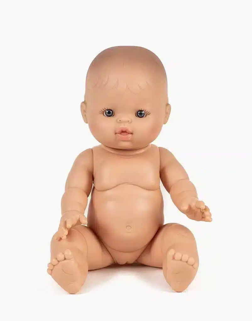 A Minikane Vintage Baby Doll (13") - Lily with a neutral expression sits upright on a plain white background, featuring a smooth surface, painted facial features, legs apart, and arms slightly reaching forward with a natural vanilla scent.