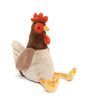 The Randy the Rooster Stuffed Animal is a soft and snuggly toy designed to look like a sitting chicken. This plush rooster features a brown body, a grayish-white belly and wings, and orange feet. It also includes an orange beak, red wattle, and comb, with detailed stitched eyes and other facial features.