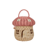 A handwoven Olli Ella Mushroom Basket purse with a pink domed lid, resembling a mushroom. It features a structured handle and a small front door design, set against a plain background.