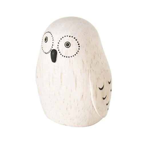 A small, Handmade Tiny Wooden Exotic Animals - Owl figurine painted in white with black, simplistic, circular eyes and dots for feathers on a plain albizia wood background.
