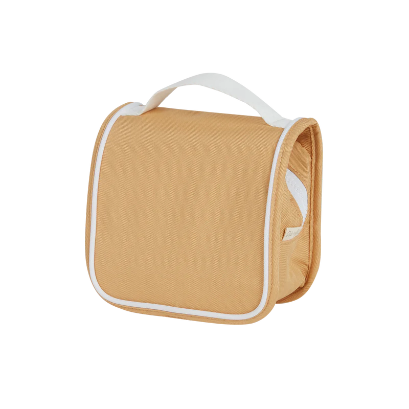A Olli Ella See Ya Wash Bag - Butterscotch, displayed against a black background — your perfect travel buddy for kiddos.
