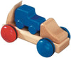 The Fagus Wooden Car Transporter - Mini Series features a charming blue and red-wheeled design, a distinctive blue car shape on top, and natural wood-colored body parts.