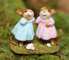 Two Wee Forest Folk Tiny Collectible - Funny Friends figurines, hand-sculpted mice in pastel blue and pink dresses, stand together on a mossy base with white flowers, appearing to happily interact.