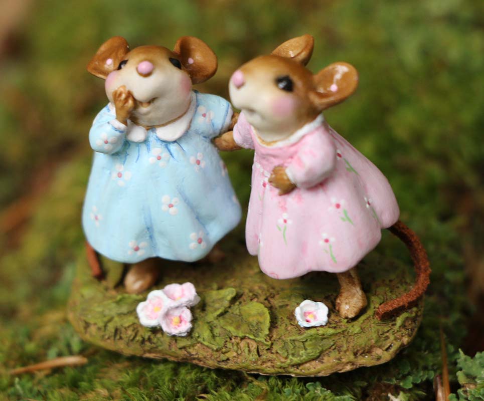 Two Wee Forest Folk Tiny Collectible - Funny Friends miniatures, hand-sculpted mice in blue and pink dresses, stand on moss holding hands, surrounded by tiny white and pink flowers. Not a toy; for collection display only.