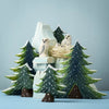 The Bumbu Handmade Wooden Snowy Owl Wilderness Set features pine trees, a snowy mountain, and white owl figurines—an eco-friendly Montessori toy ideal for learning and play against a serene blue backdrop.